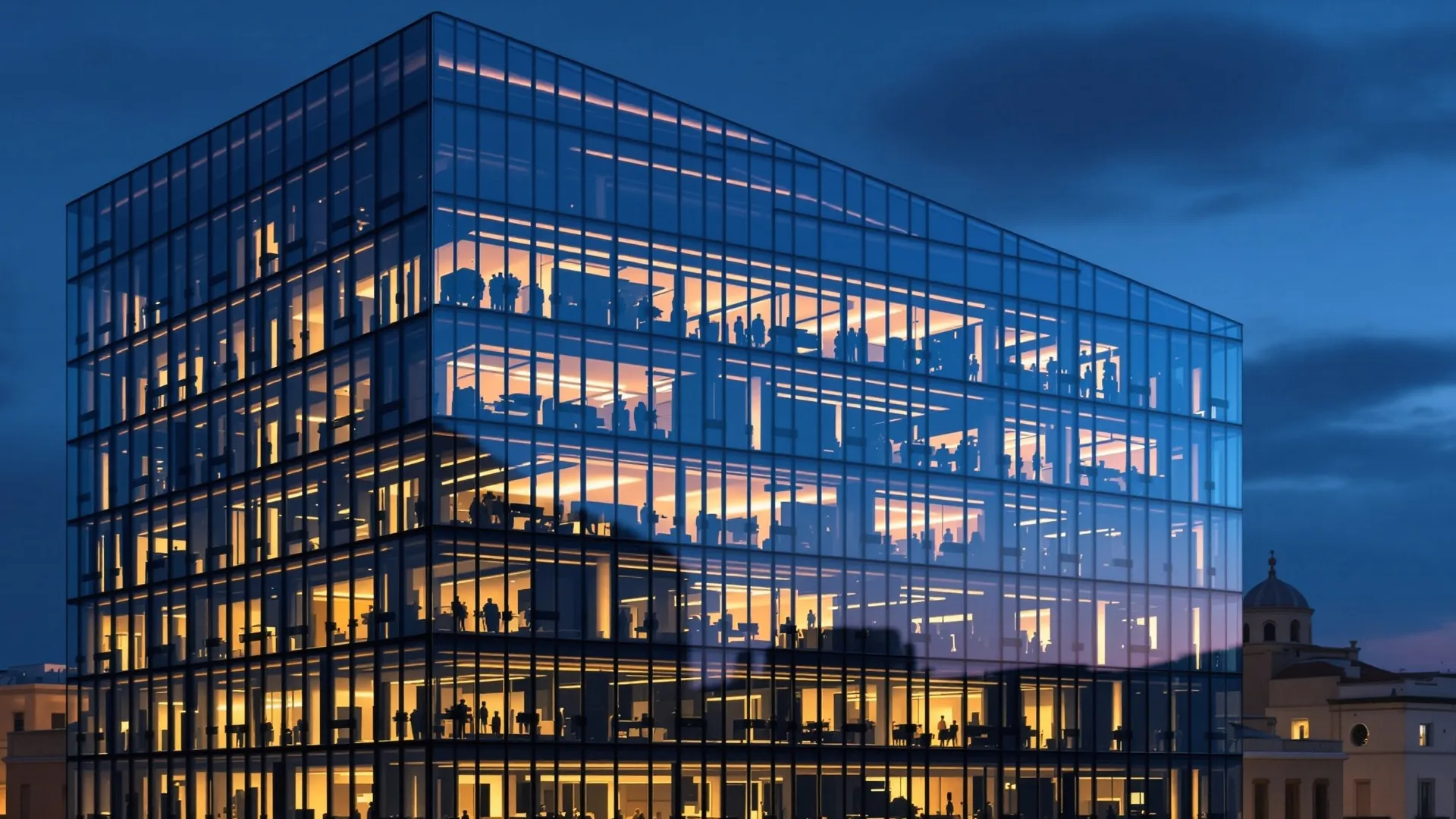 A modern glass office building in Malta's financial district at dusk, warm interior lights against a Mediterranean sky, limestone buildings in the background. Wide landscape format.