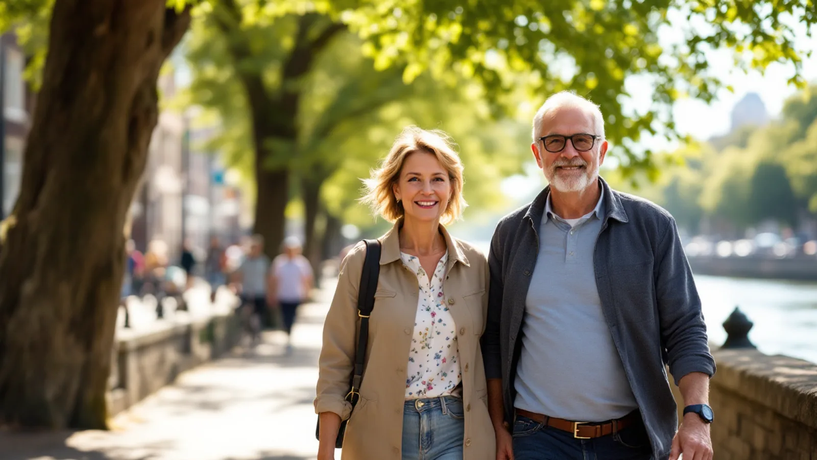 International couple in their fifties on a sunny rooftop terrace above a Mediterranean city