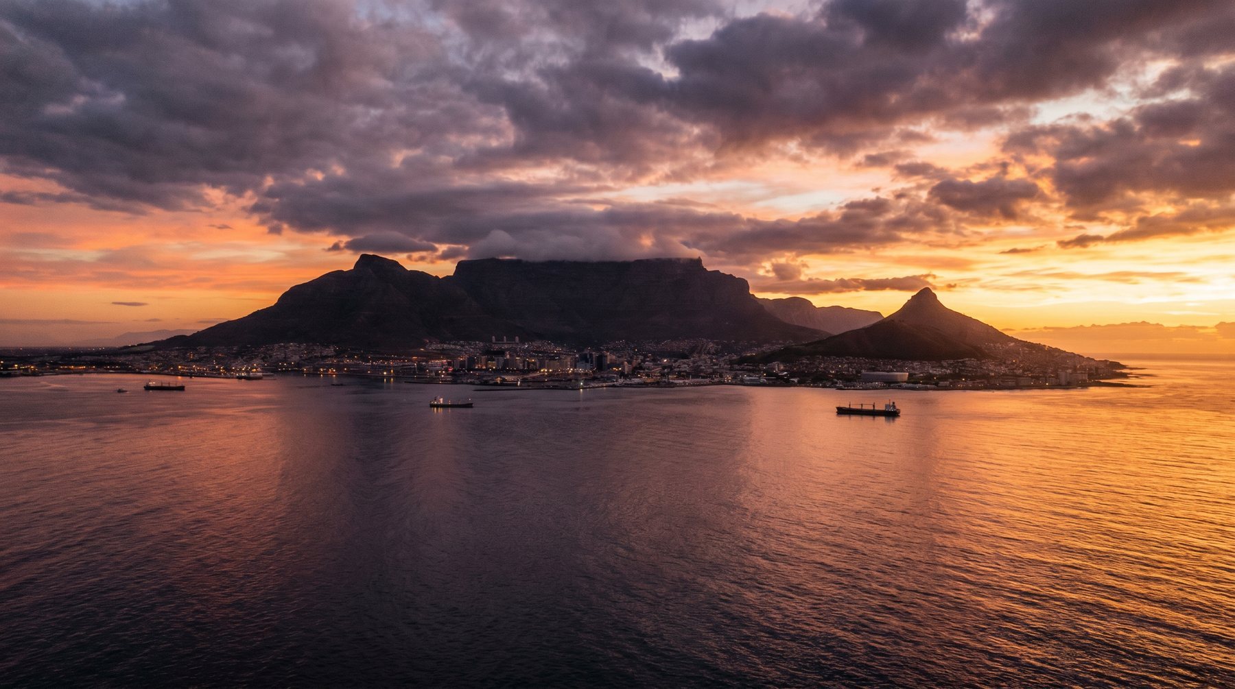 Table Mountain and Cape Town coastline at sunset — South Africa