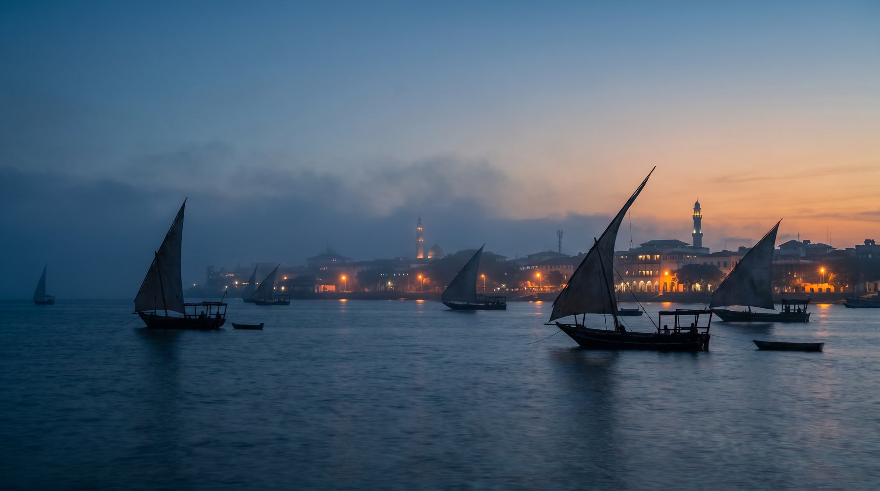 Dhows and Stone Town waterfront at blue hour — Zanzibar