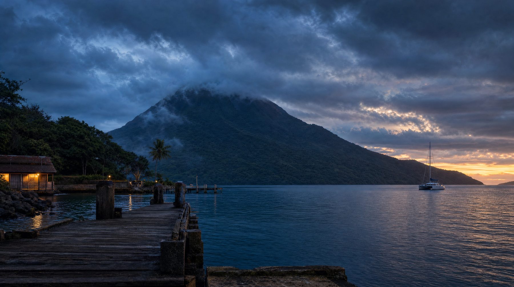 Vanuatu blue-hour harbour with volcanic hills
