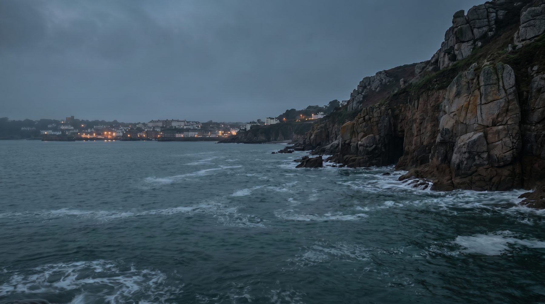English Channel tide below granite cliffs — Guernsey