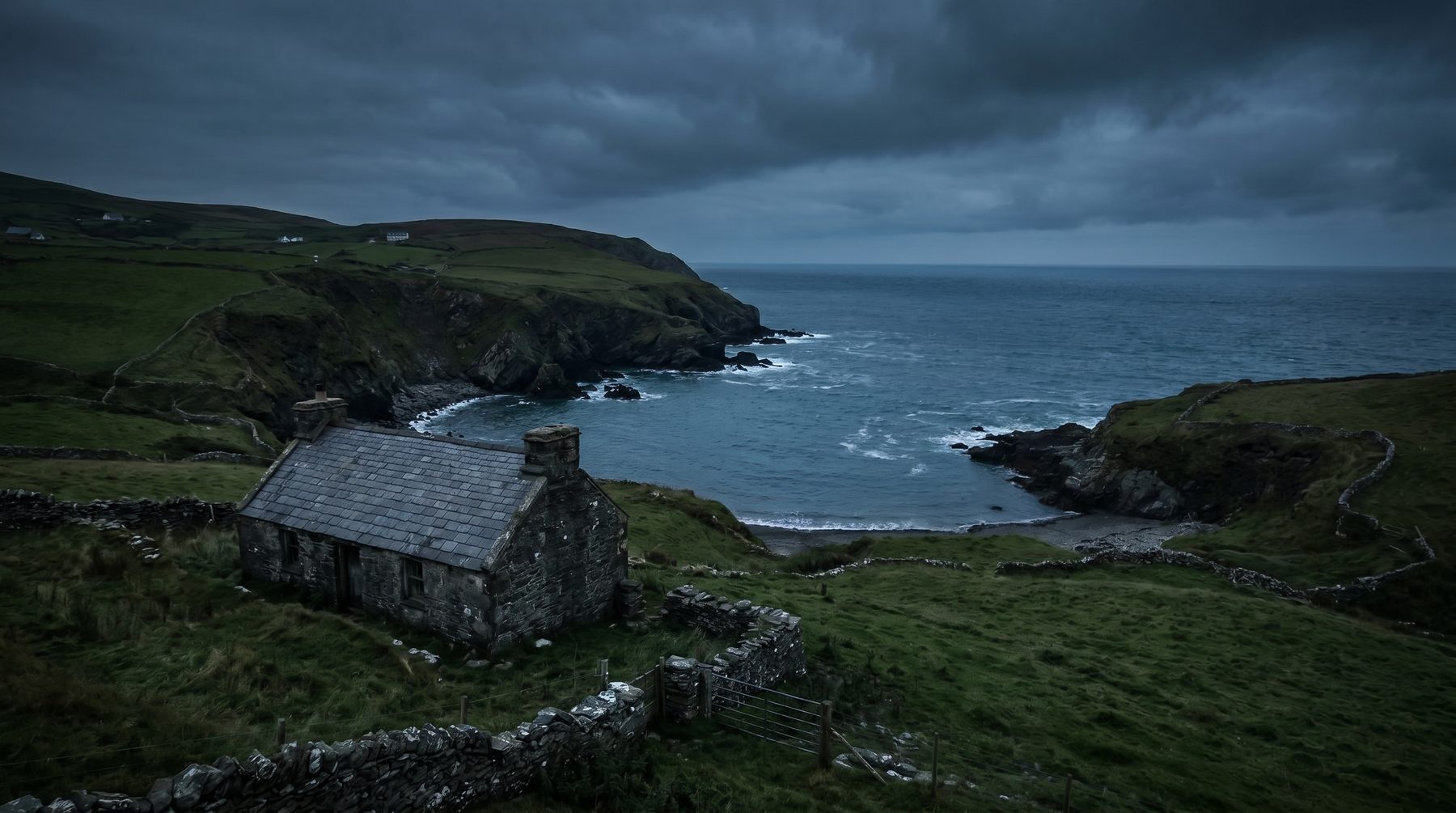 Manx stone house above a sheltered bay — Isle of Man