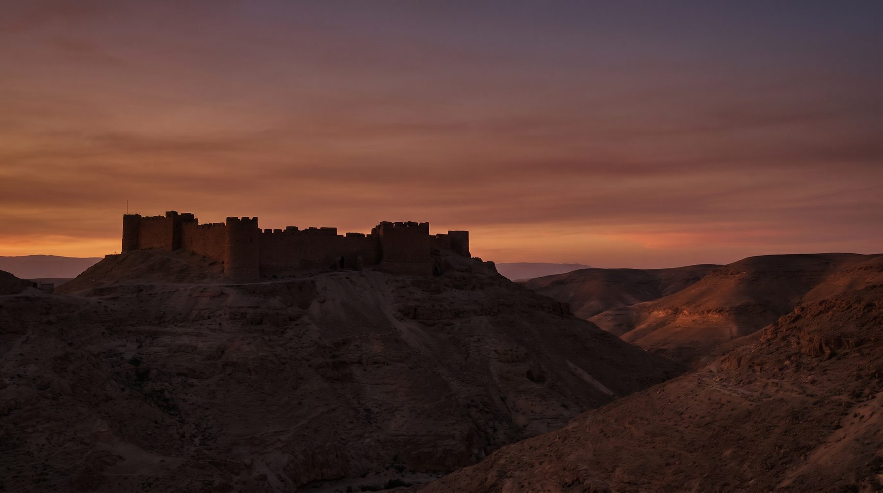 Desert fortress silhouette at dusk — Israel