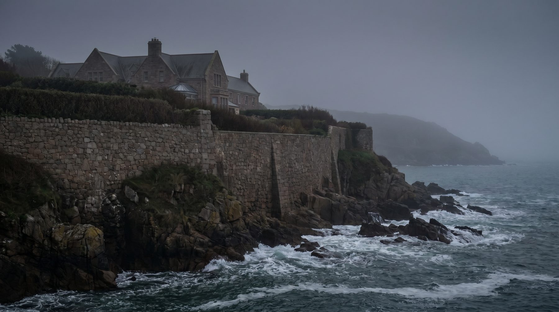 Jersey coastal residence behind granite wall — Jersey