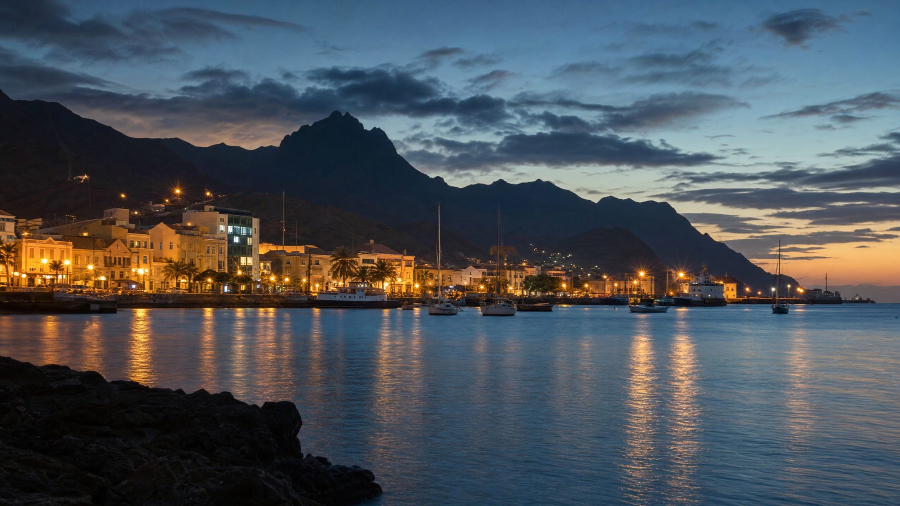 Mindelo harbour and Cape Verde volcanic silhouettes at blue hour