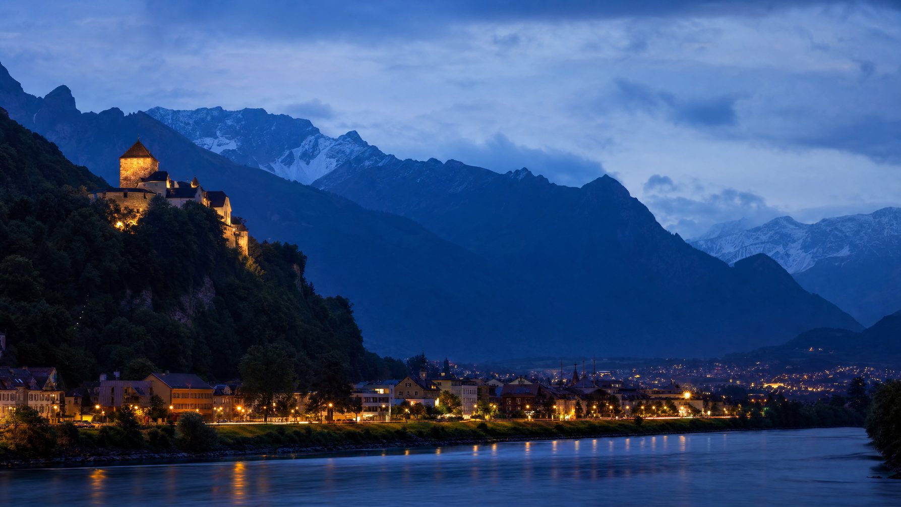 Vaduz, the Rhine valley, and the Alps at blue hour