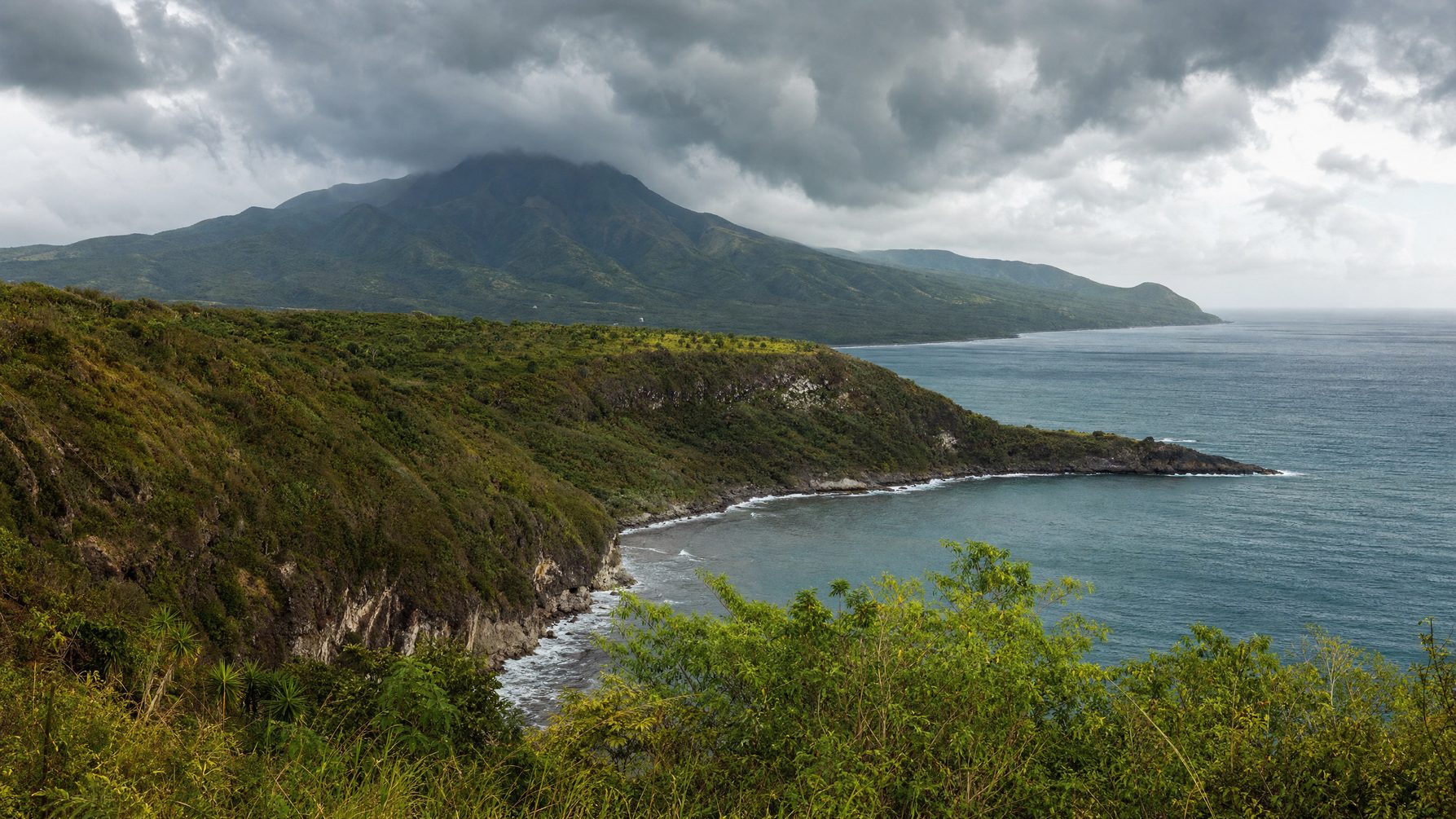 Saint Kitts volcanic coastline and green hills