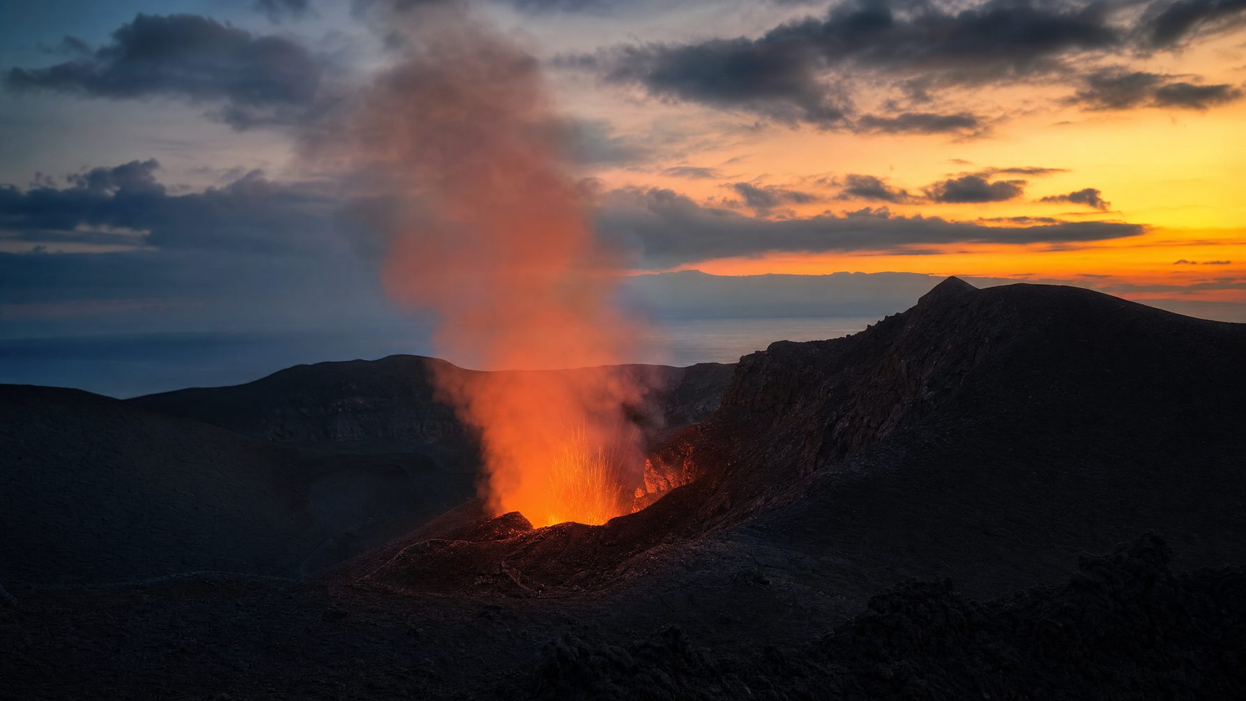 Mount Yasur volcano glowing at dusk on Tanna Island